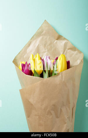 tulips wrapped in brown paper Stock Photo