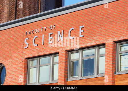 Lund, Sweden - January 21, 2016: Sign on a brick building at Lund university saying Faculty of science. Red brick wall and some Stock Photo