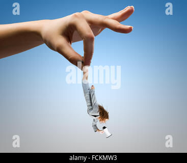 Giant human hand holding miniature of businesswoman Stock Photo - Alamy