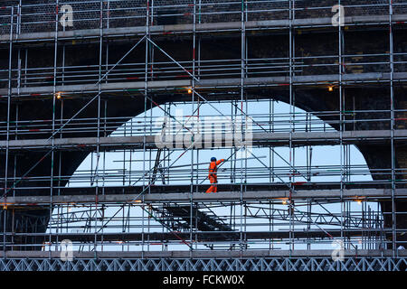 Railway workers on scaffolding carrying out maintainance work on the Runcorn - Widnes railway bridge. Stock Photo
