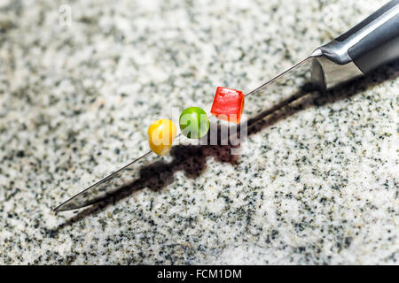 cutting on a knife, metal, steel, stainless steel, kitchen utensil, cooking, cook, food, modern, stylish, sharp, cutting, crushi Stock Photo