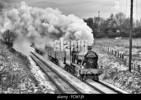 Hall class 4-6-0 Witherslack Hall steam train heading through the snowy Leicestershire countryside on the Great Central Railway Stock Photo