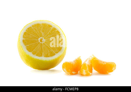 lemon and three slices of tangerine isolated on a white background Stock Photo