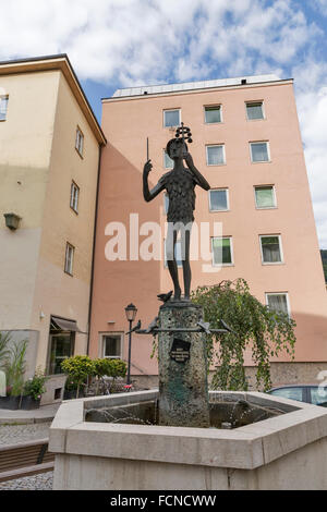 Stone figurine of bird catcher Papageno, a charakter in Mozart opera The Magic Flute, fountain in Salzburg, Austria. Stock Photo