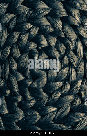 Closeup dark brown wicker woven pattern for abstract background or texture Stock Photo