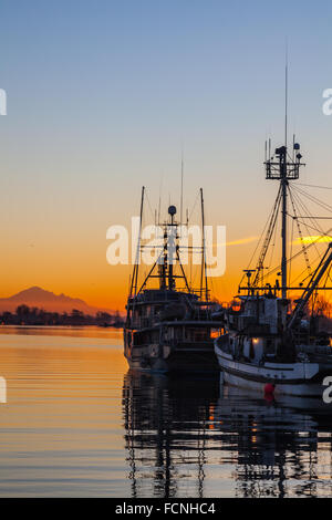 Commercial Salmon Fishing Boats Rest At Anchor In The Naknek River After  Sunset While Rain Falls In The Distance; Bristol Bay Alaska United States Of   - SuperStock