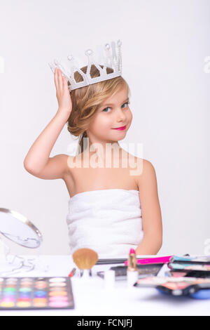 Nice little girl doing make up Stock Photo
