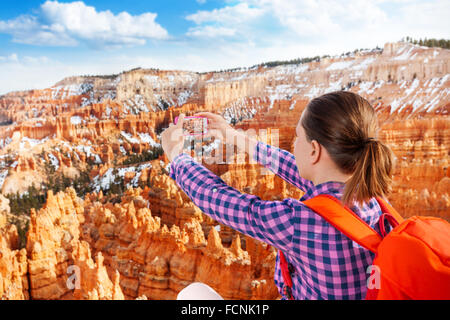 Close portrait of woman take Bryce canyon picture Stock Photo