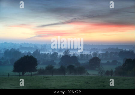 Rising Mist over River Stour at sunset, near Flatford, Dedham Vale, Essex / Suffolk border, England, October 2015 Stock Photo