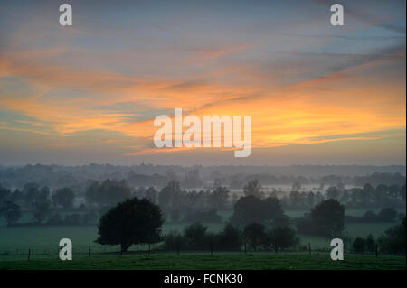 Rising Mist over River Stour at sunset, near Flatford, Dedham Vale, Essex / Suffolk border, England, October 2015 Stock Photo