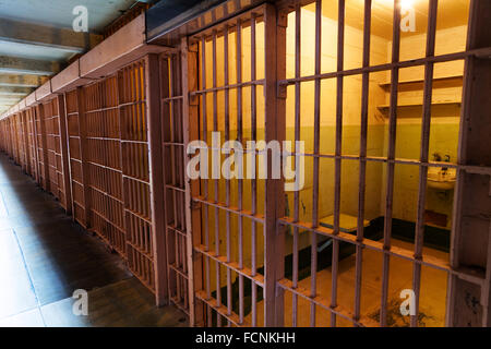 Row of prison cells with inside view Stock Photo