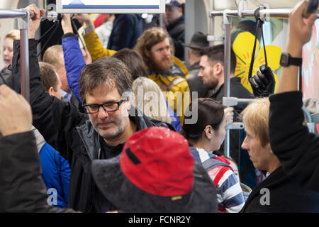 Seattle, USA. 23rd Jan, 2016. Crowd of people riding the inaugural run of the Settle Streetcar First Hill Line on January 23, 2016. The First Hill Streetcar is a 4 kilometer-long line that connects Pioneer Square and Capitol Hill via the International District, Yesler Terrace, and First Hill. It is the second line implemented after the South Lake Union Streetcar opened in 2007. Credit:  Paul Gordon/Alamy Live News Stock Photo