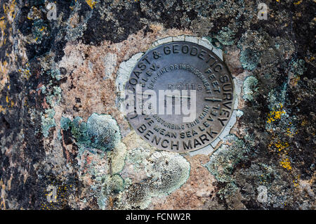 Benchmark plate of the US coast and geodetic survey, placed to mark elevation of a location.  Antelope, Oregon, USA Stock Photo