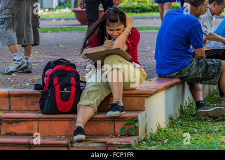 Student studying in September 23 Park at Le Lai Pha, Ho Chi Minh city Vietnam Stock Photo