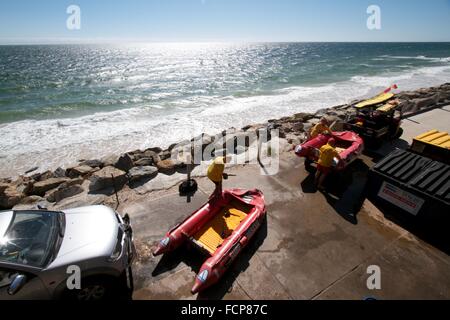 Adelaide Australia. 24th January 2016. Surf and Rescue volunteers prepare dinghy crafts to supervise beachgoers on swimming on choppy seas Credit:  amer ghazzal/Alamy Live News Stock Photo