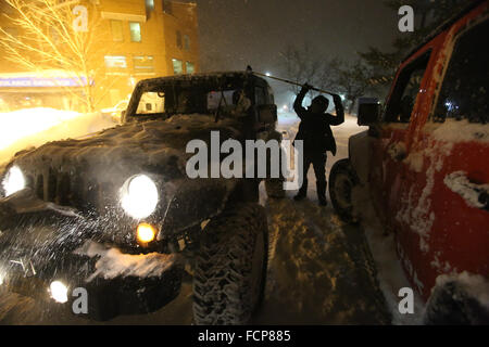 Staten Island, NY, USA. 23rd Jan, 2016. Wicked Jeep driver Marlo Dotti waits outside of Staten Island University Hospital to pick up medical staff getting off of their shifts during Winter Storm Jonas. During the blizzard, five Wicked Jeep drivers volunteered their time to pick up Staten Island residents and shuttle them safely to their destination. Late afternoon city buses ceased to run on the island, and a New York City travel ban was later enforceable by the NYPD. This lack of transportation stranded many residents of Staten Island who had taken the ferry home, or needed to get to Manhatt Stock Photo