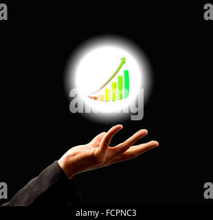 Businessman holding  growing graph in abstract light Stock Photo