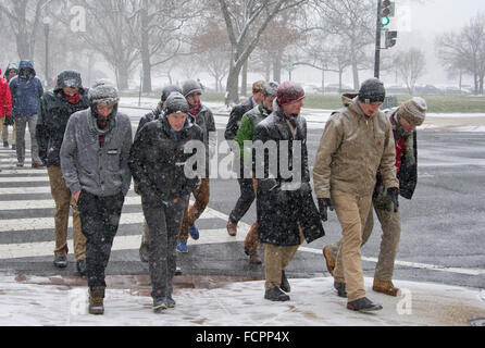 Participants in the annual March for Life walk through the snow near the United States Capitol in Washington, DC on Friday, January 22, 2016. Snow totals of upwards of thirty inches are expected in the Washington Metro Area before the storm passes on Sunday morning. Credit: Ron Sachs / CNP (RESTRICTION: NO New York or New Jersey Newspapers or newspapers within a 75 mile radius of New York City) - NO WIRE SERVICE - Stock Photo