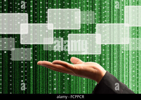 hand hold a touch screen interface with digital matrix background Stock Photo