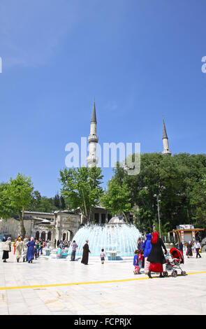 People walking near The Eyup Sultan Mosque in Eyup district of Istanbul, Turkey Stock Photo