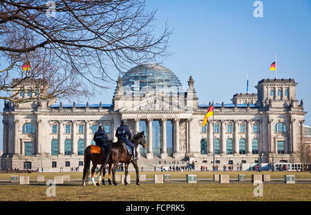 BERLIN, GERMANY - FEBRUARY 26, 2015: Two policemen on horseback near the Reichstag (Bundestag) building in Berlin, Germany Stock Photo