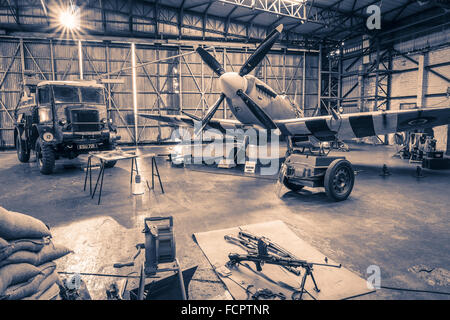 A recreated scene from world war two of an active Spitfire hangar as the aircraft is refuelled. Stock Photo