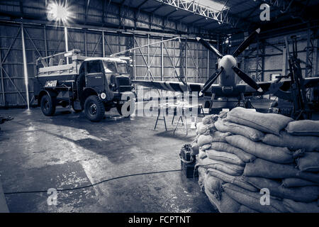 A recreated scene from world war two of an active Spitfire hangar as the aircraft is refuelled. Stock Photo