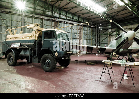 A recreated scene from world war two of an active Spitfire hangar as the aircraft is refuelled. Stock Photo