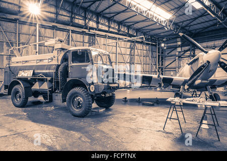 A recreated scene from world war two of an active Spitfire hangar as the aircraft is refuelled. Stock Photo