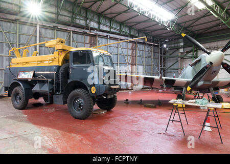 A recreated scene from world war two of an active Spitfire hangar as the aircraft is refuelled. Stock Photo