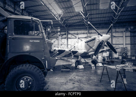 A recreated scene from world war two of an active Spitfire hangar as the aircraft is refuelled. Stock Photo