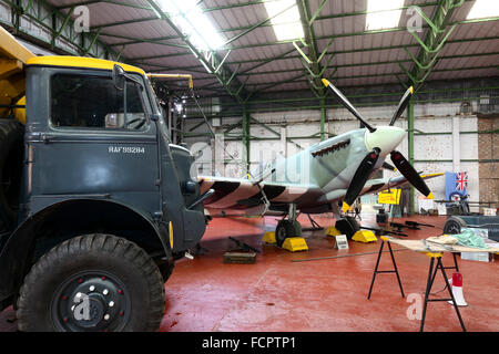 A recreated scene from world war two of an active Spitfire hangar as the aircraft is refuelled. Stock Photo