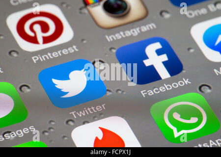 Social media icons, including twitter and facebook apps on an iphone 6 screen Stock Photo