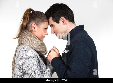 portraits of young couple in love, man and woman, wearing winter clothes Stock Photo