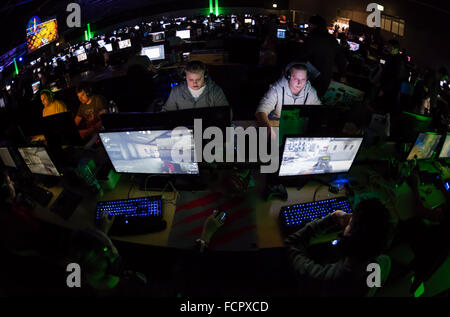 Computer game players are playing the first person shooter "Counterstrike CS:GO" at a computer game tournament. Stock Photo