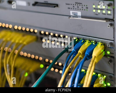 Computer network router / switch with LAN cables Stock Photo