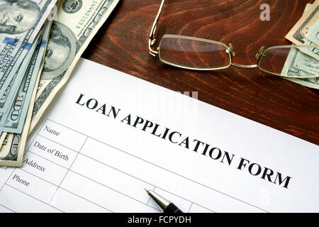 Loan application form on a wooden table. Stock Photo