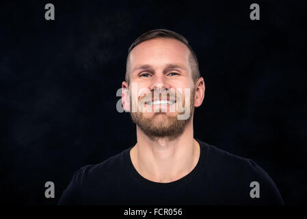 Handsome man looking at camera. Stock Photo