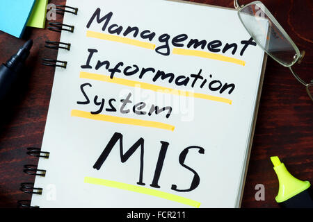 Notepad with Management information system MIS on the wooden table. Stock Photo