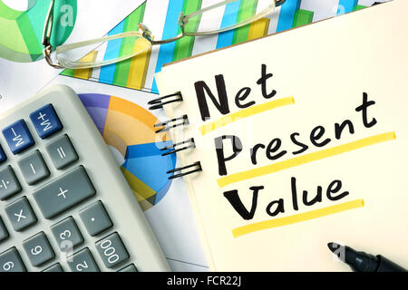 Notepad with Net present value (NPV) on the wooden table. Stock Photo