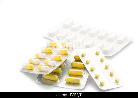 Yellow capsules pill blister pack Stock Photo