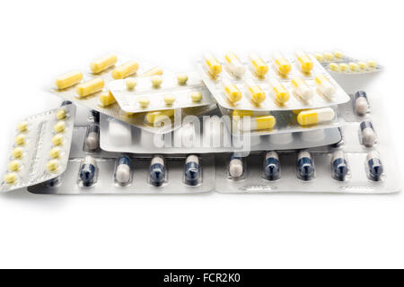 Heap blister packs of colorful pills and capsules Stock Photo