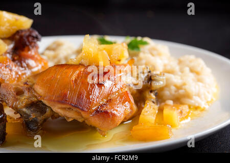 Fried chicken with pineapple and white rice with parmesan Stock Photo