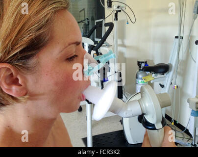 Breathing, Spirometry in a blonde woman Stock Photo