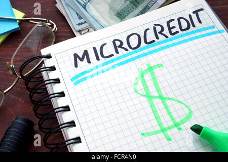 Microcredit written on a notebook. Business concept. Stock Photo