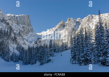 Snowy mountains loom over Dream Lake in the Rocky Mountains of Colorado Stock Photo
