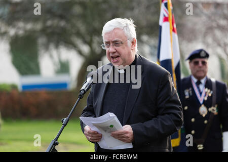 Romford, Essex, UK. 24th Jan 2016. Reverend Mike Power from St Edward the Confessor church speaking at a commemorative service in Coronation Gardens, Romford to commemorate Holocaust Memorial Day which falls on 27th January 2016. Credit:  London pix/Alamy Live News Stock Photo