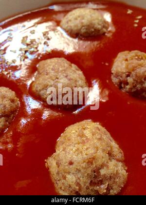 Fried large homemade meatballs in tomato sauce Stock Photo