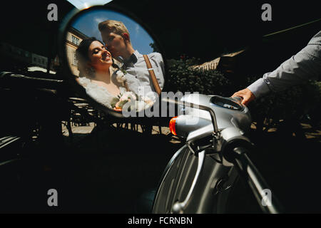 bride and groom in the mirror reflection Stock Photo