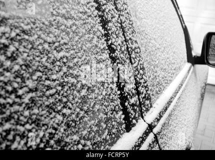 Fresh snow layer on a car Stock Photo